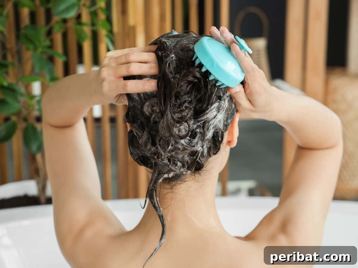 A woman in a shower, gently rinsing her hair, illustrating moderate hair washing.