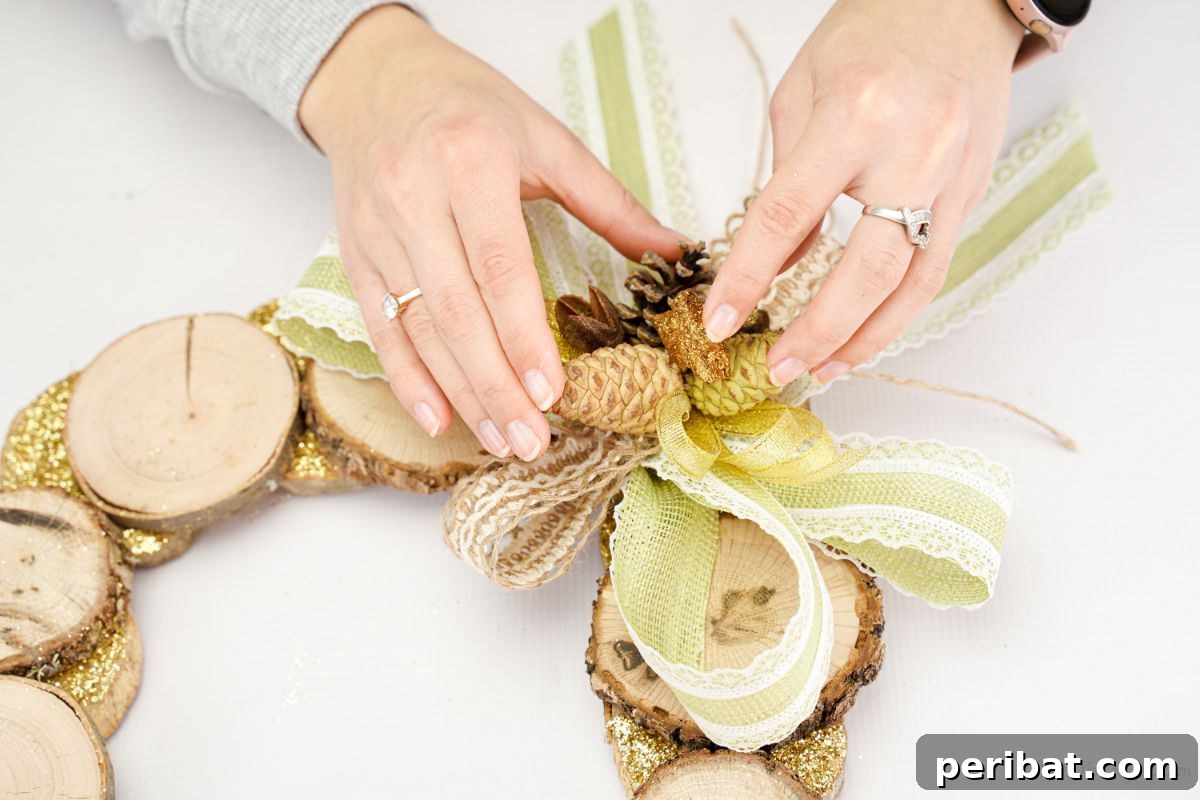 Natural Branch Slice Wreath Adorned with Pinecones 19 Pinecones being glued onto bow on wreath
