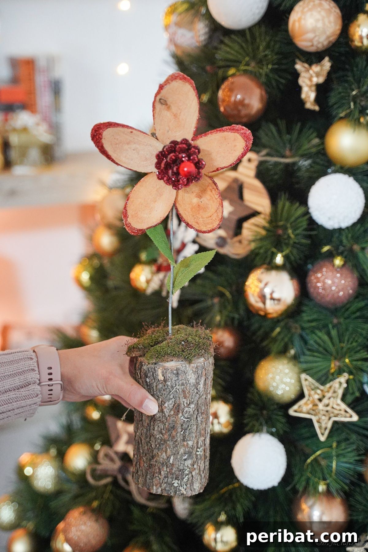 lady holding wood slice flower