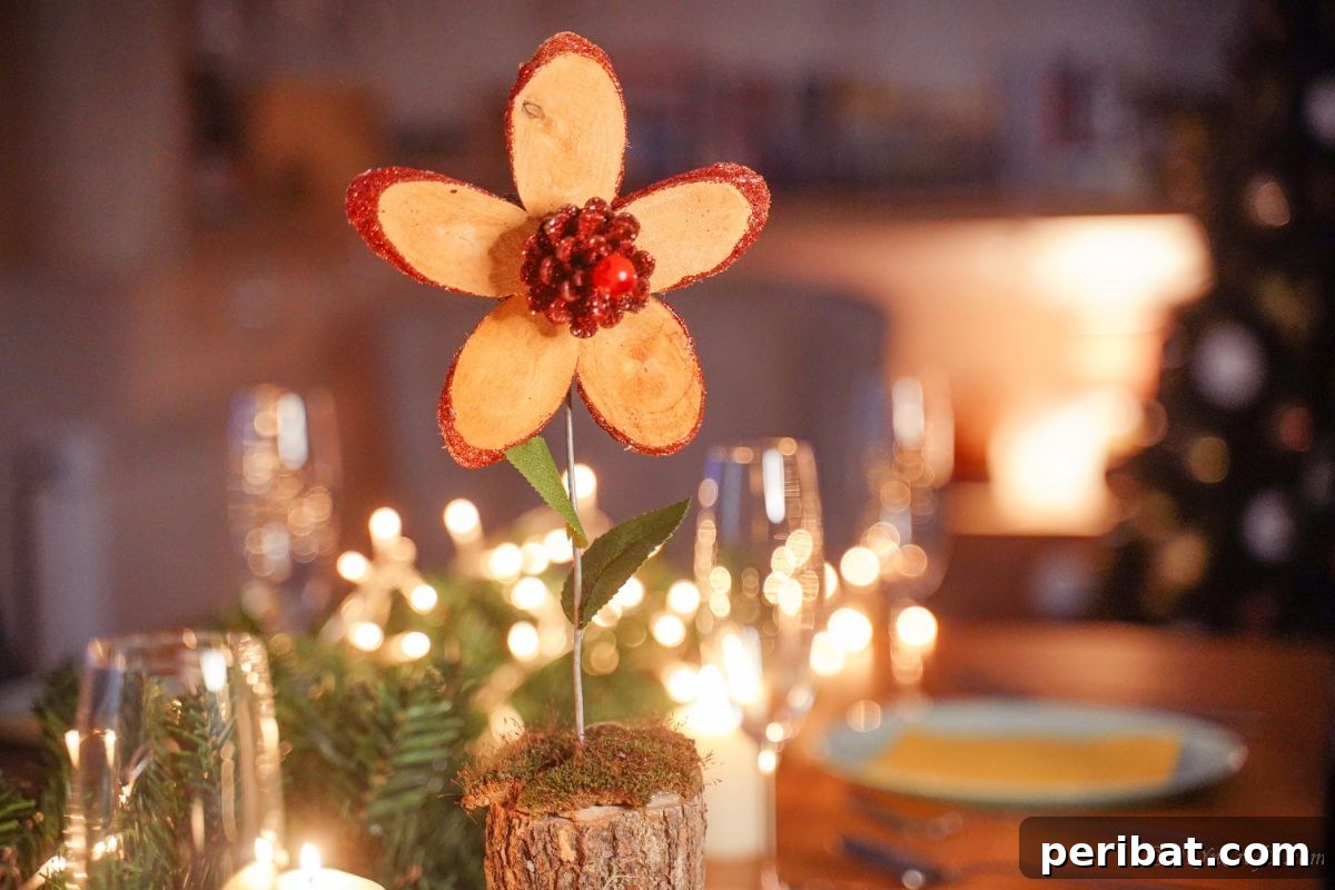 red glitter wood flower on table with tree in background
