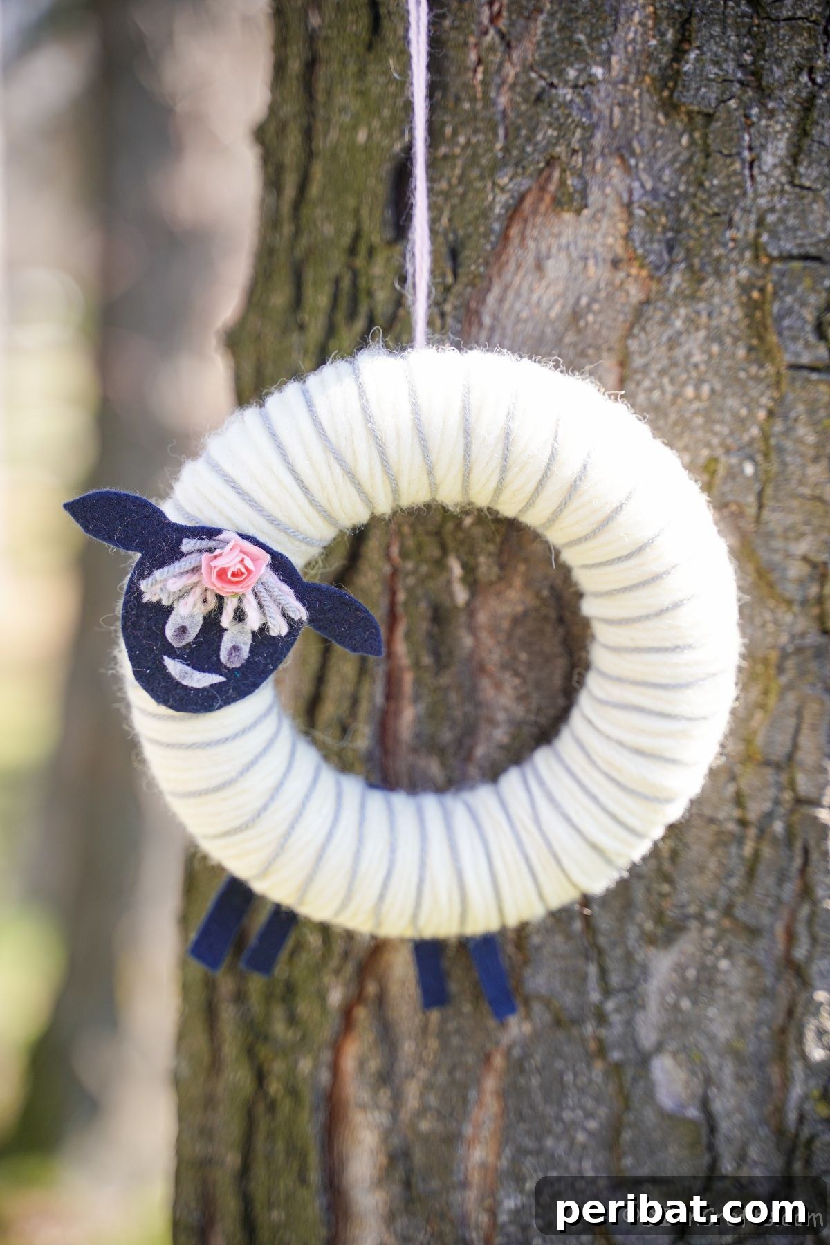 Whimsical Woolly Lamb Easter Wreath 2 Adorable yarn sheep Easter wreath hanging on a tree, ready to welcome spring and charm visitors.