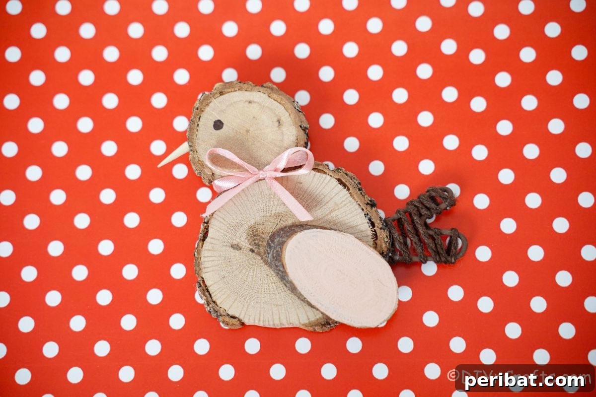 wood slice chick on red and white polka dot paper, symbolizing rustic spring decor