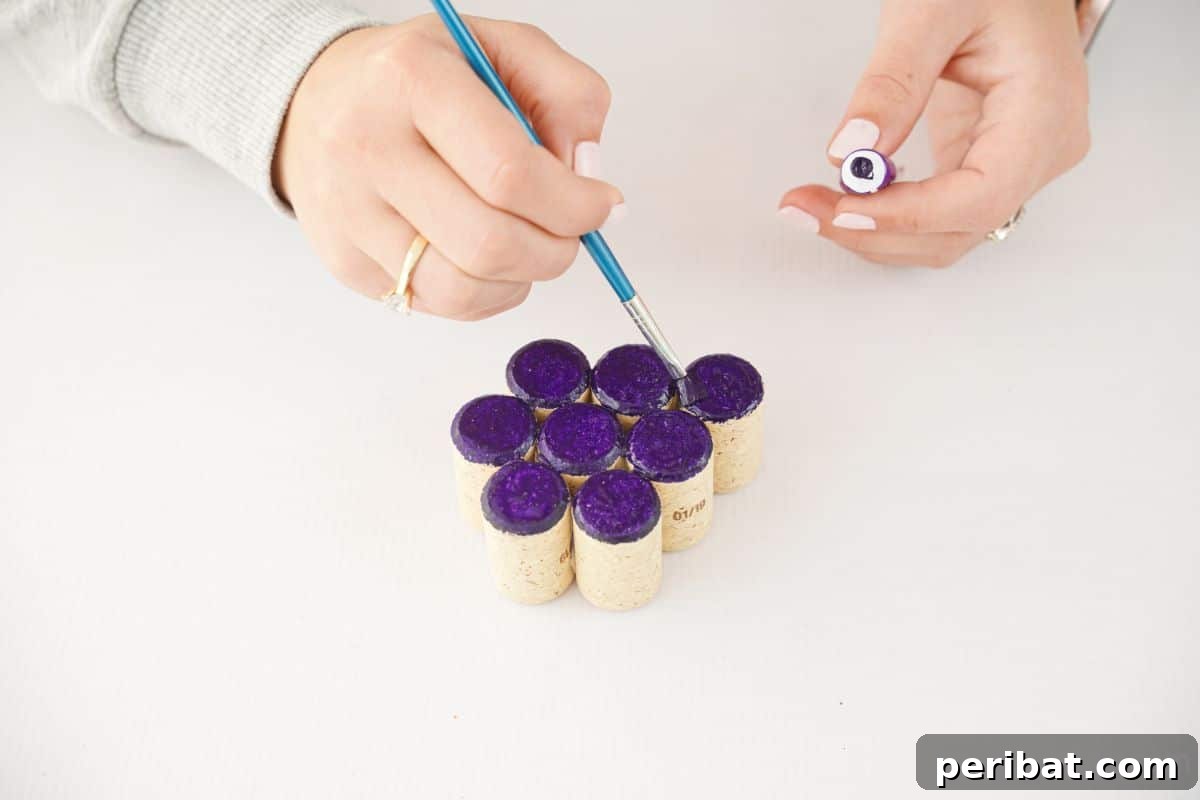 hand painting tops of cork purple