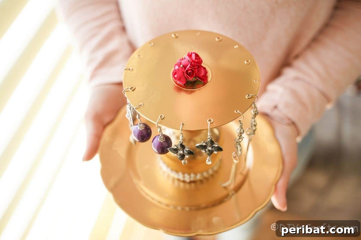 Elegant Repurposed Plate Jewelry Organizer 19 lady holding gold jewelry stand