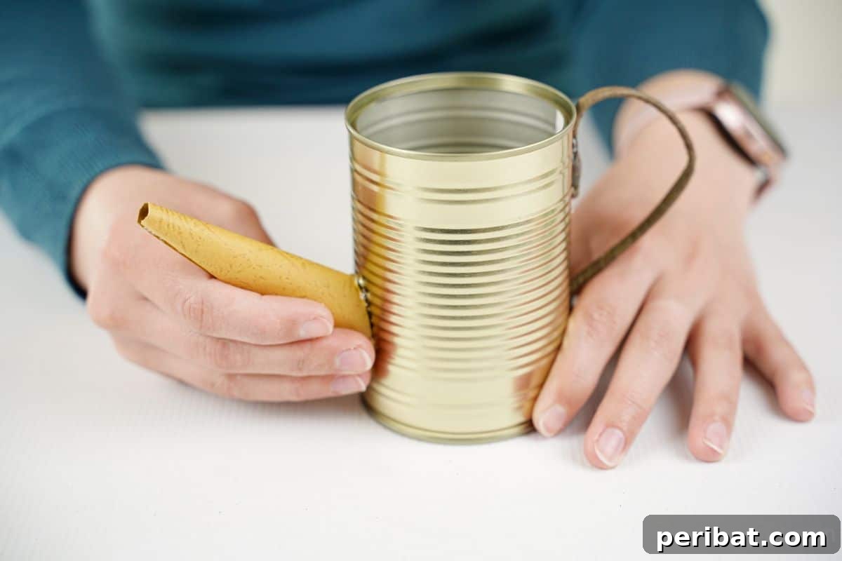 Rustic Coffee Motif Tin Watering Can 15 Hand gluing the paper spout onto the tin can, opposite the handle, to complete the watering can shape