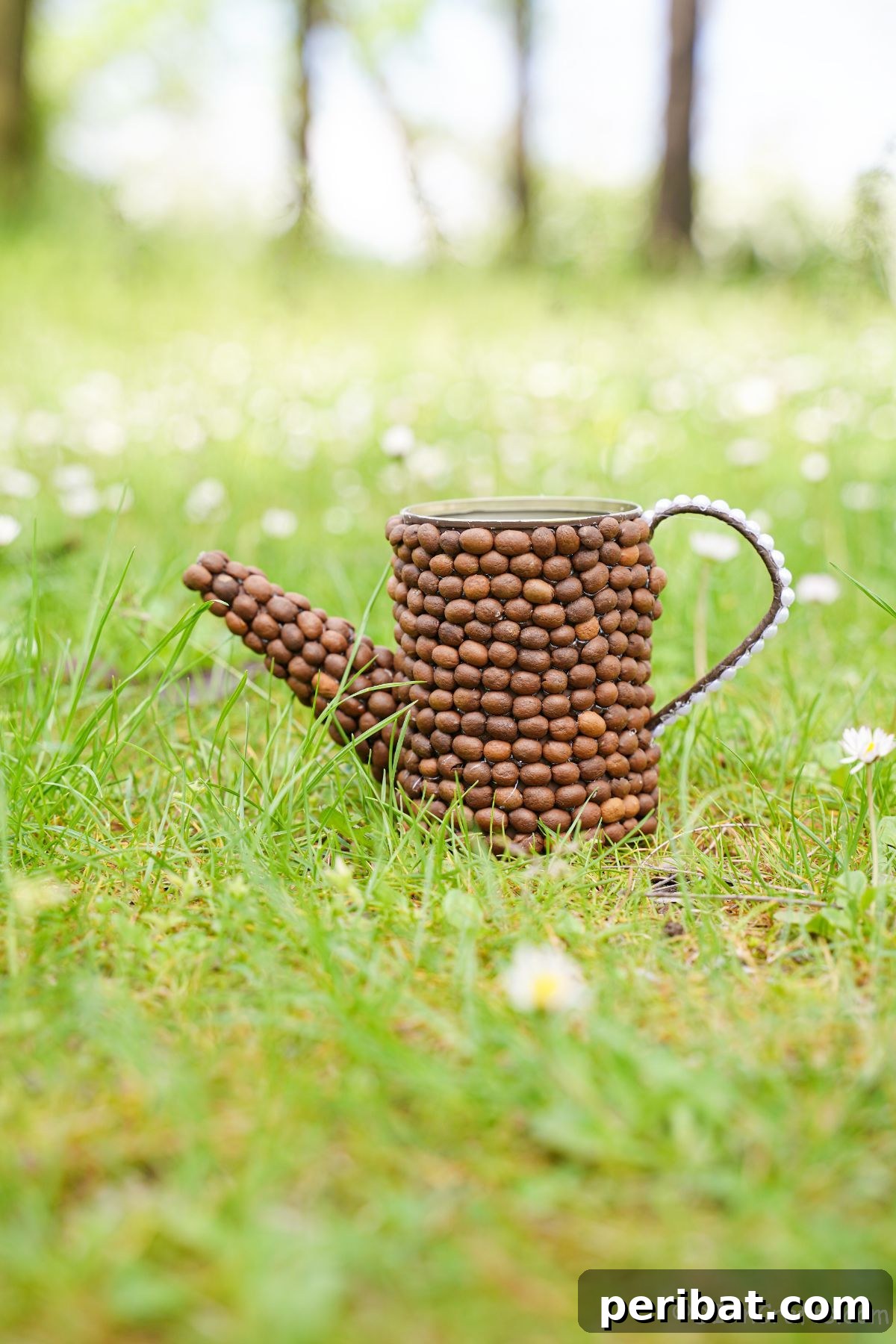 Rustic Coffee Motif Tin Watering Can 7 Coffee bean covered upcycled tin can watering can sitting on lush green grass