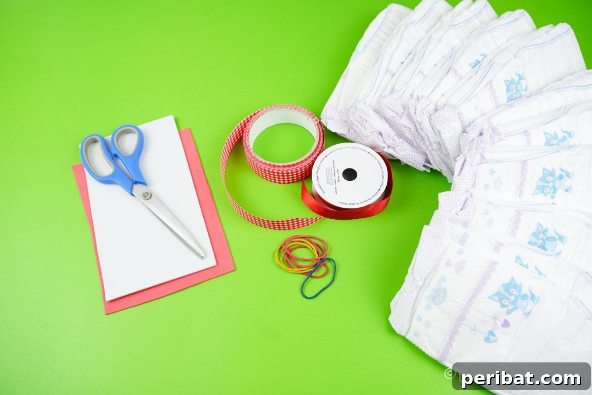 Crafting supplies including rolled diapers, red ribbon, and rubber bands, neatly arranged on a green crafting table.
