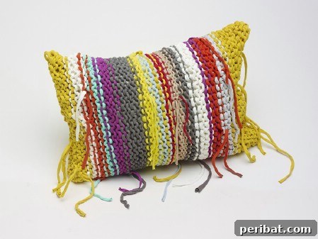 Make a colorful pillow with yarn scraps