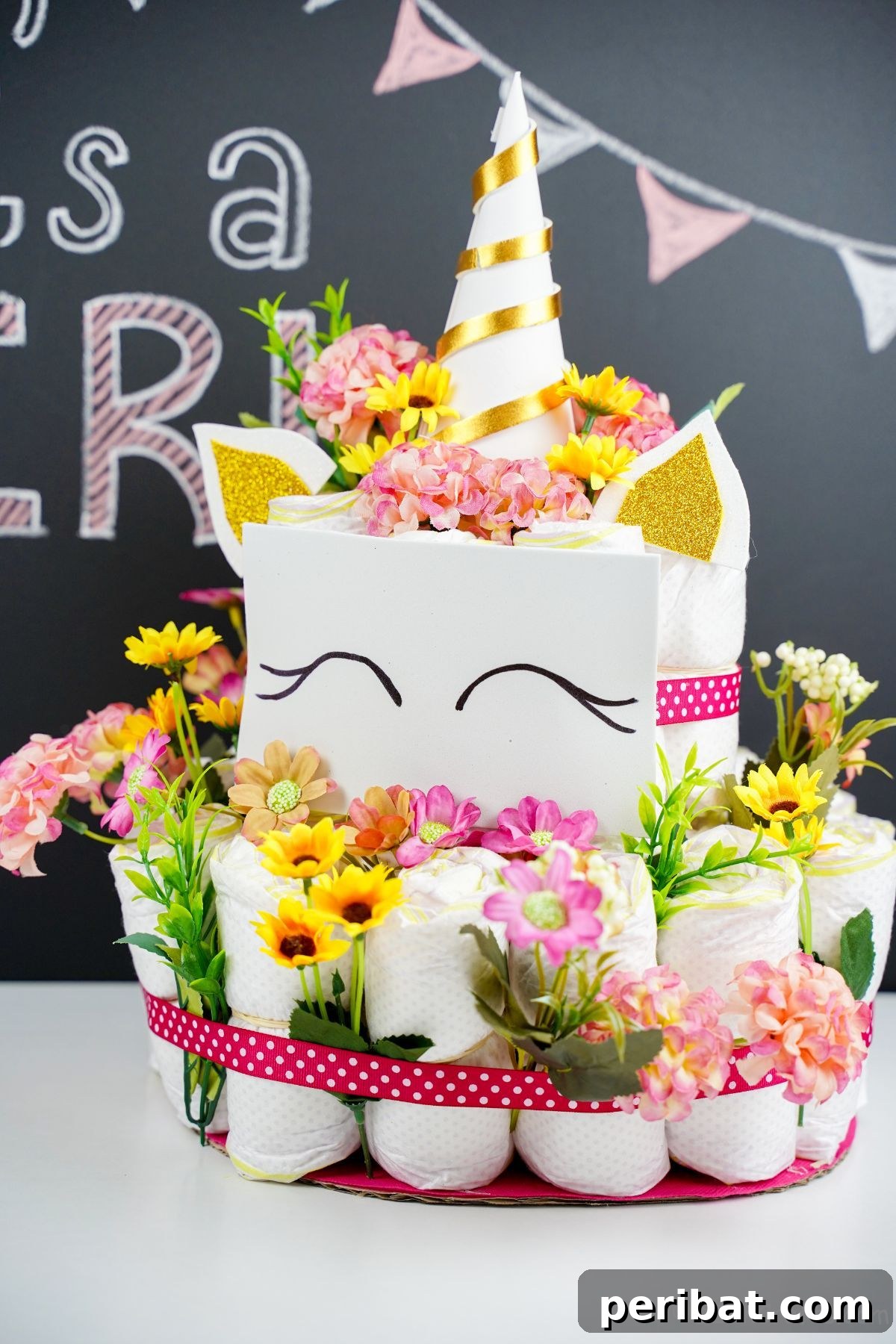 Create a Magical Unicorn Diaper Cake 23 Unicorn diaper cake in front of a chalkboard background