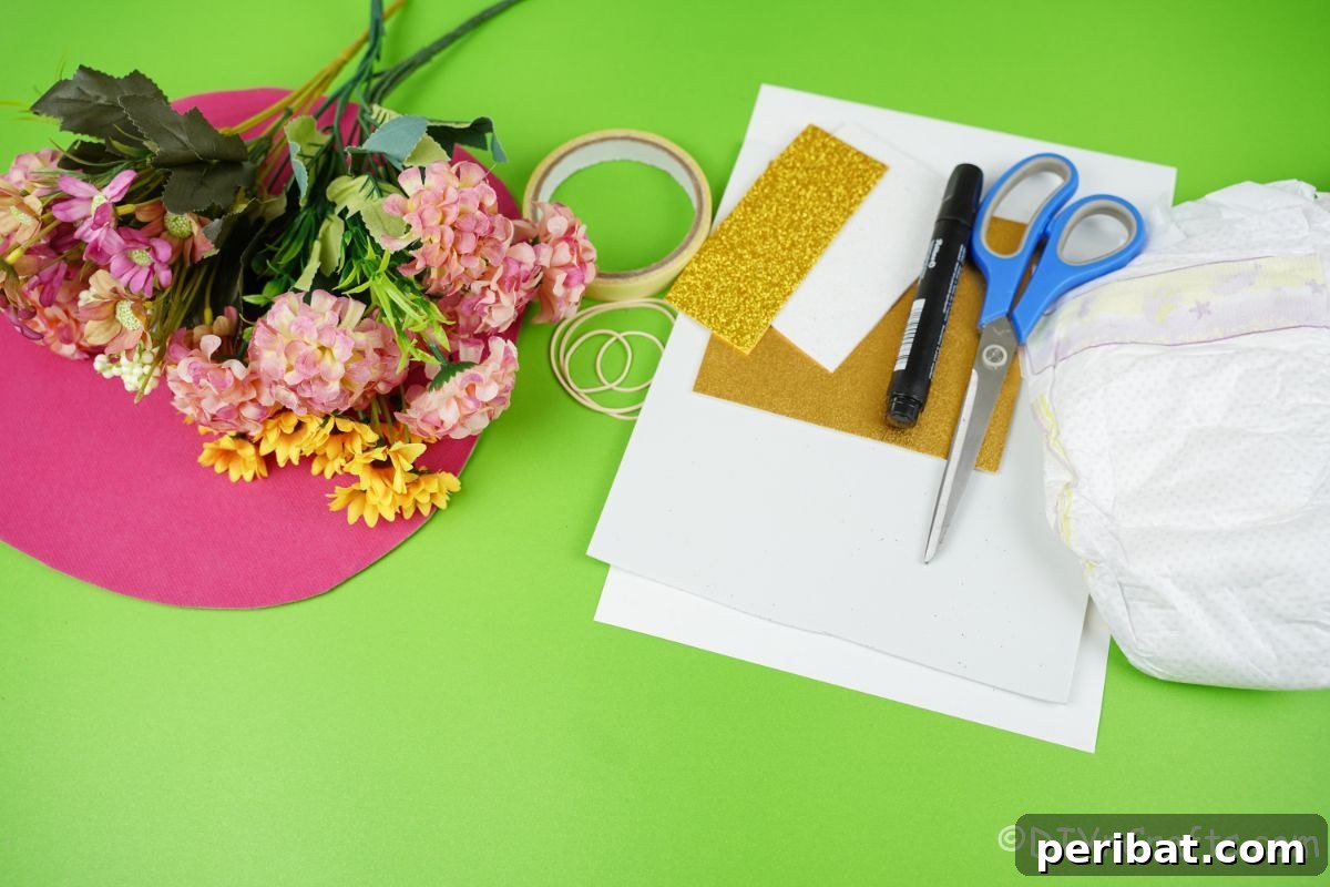 Create a Magical Unicorn Diaper Cake 8 Diapers, pink paper, white paper, and fake flowers on a green table, ready for crafting