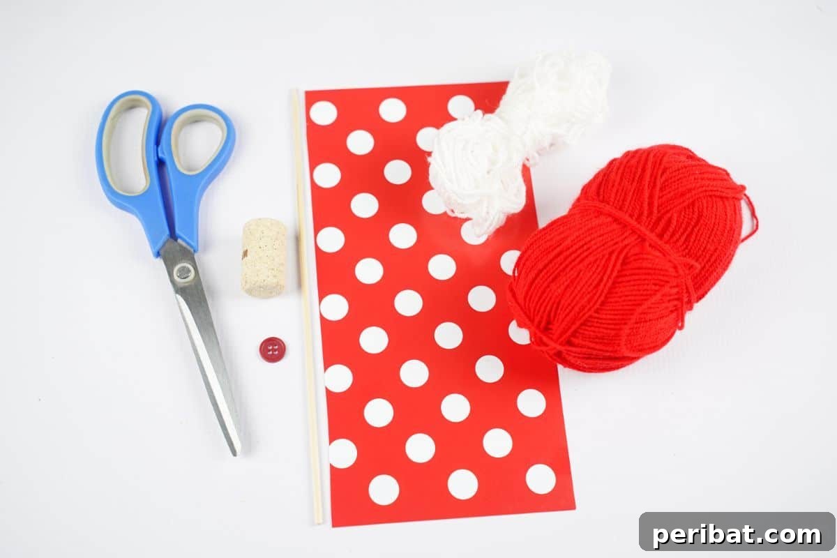 red and white paper with red yarn white yarn and blue scissors on white table