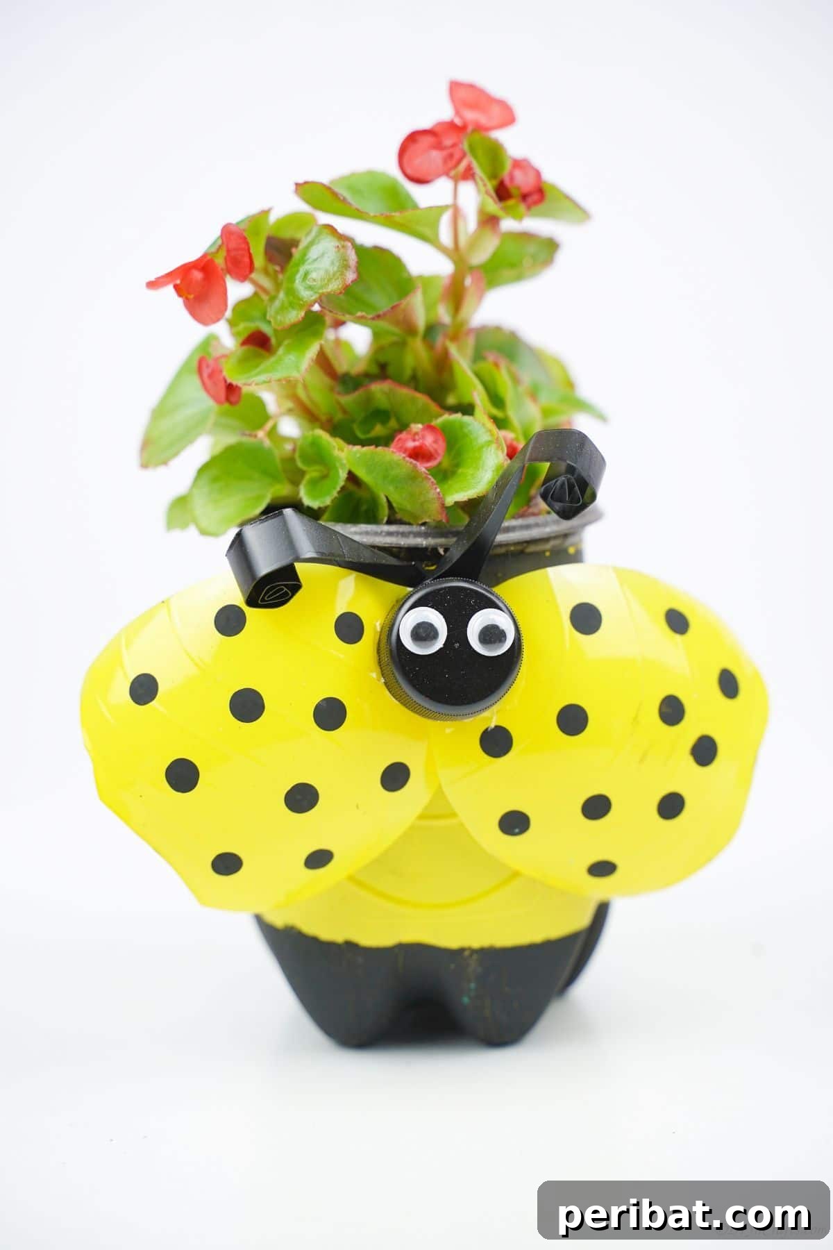 Upcycled Ladybug Garden Gems 22 plastic bottle ladybug planter painted yellow