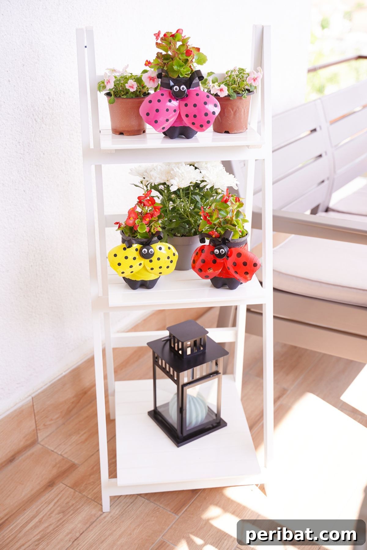 Upcycled Ladybug Garden Gems 5 ladybug planters next to terra cotta pots n white ladder