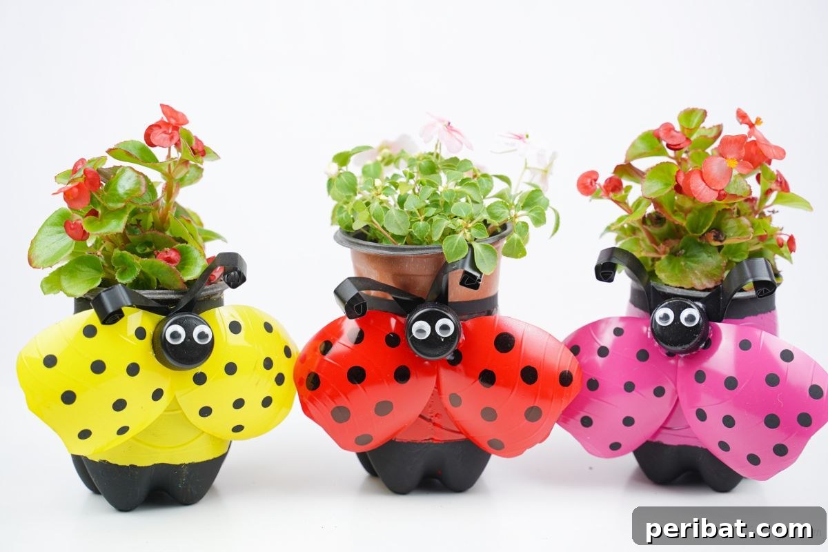 Upcycled Ladybug Garden Gems 6 pink red and yellow ladybug planters on white table