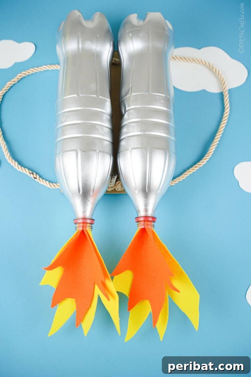Bottle Blaster Backpack 10 light blue background behind silver bottle jet pack