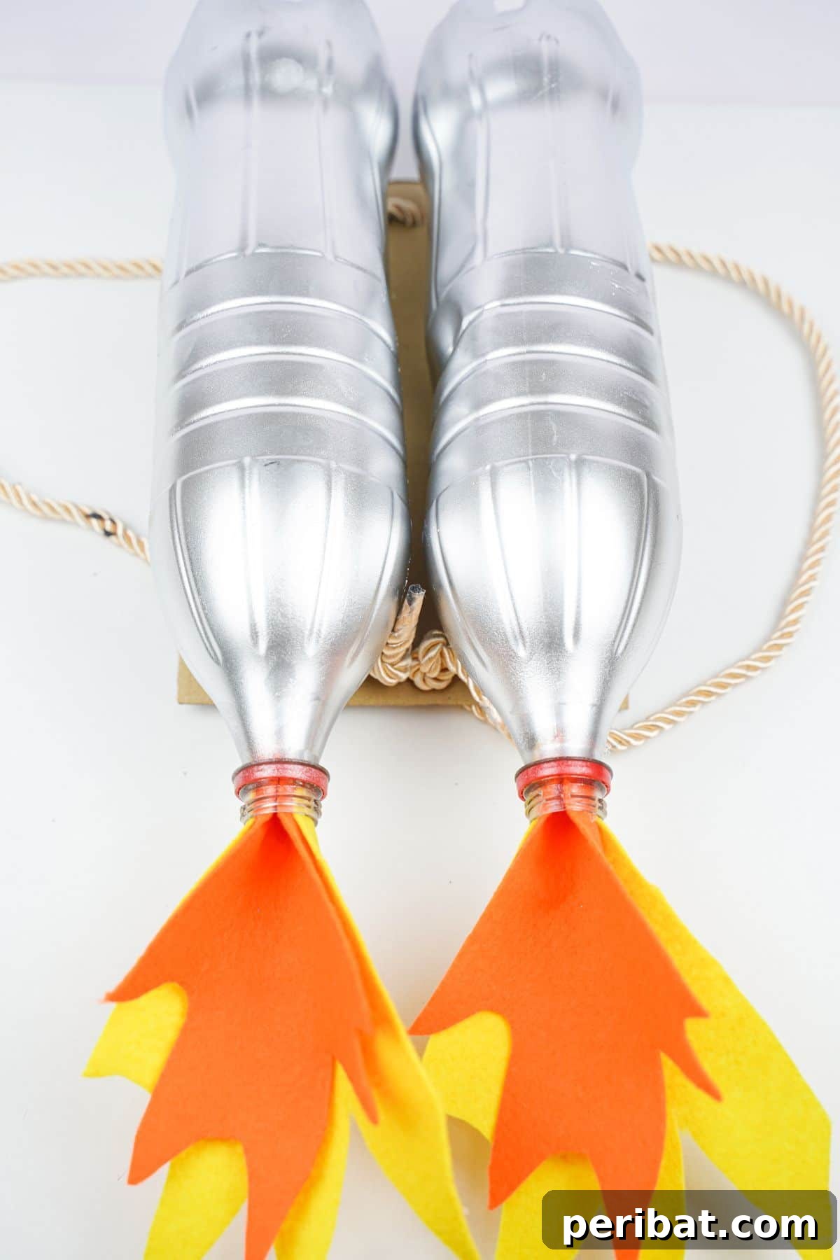Bottle Blaster Backpack 5 jet pack costume with rope straps on white table