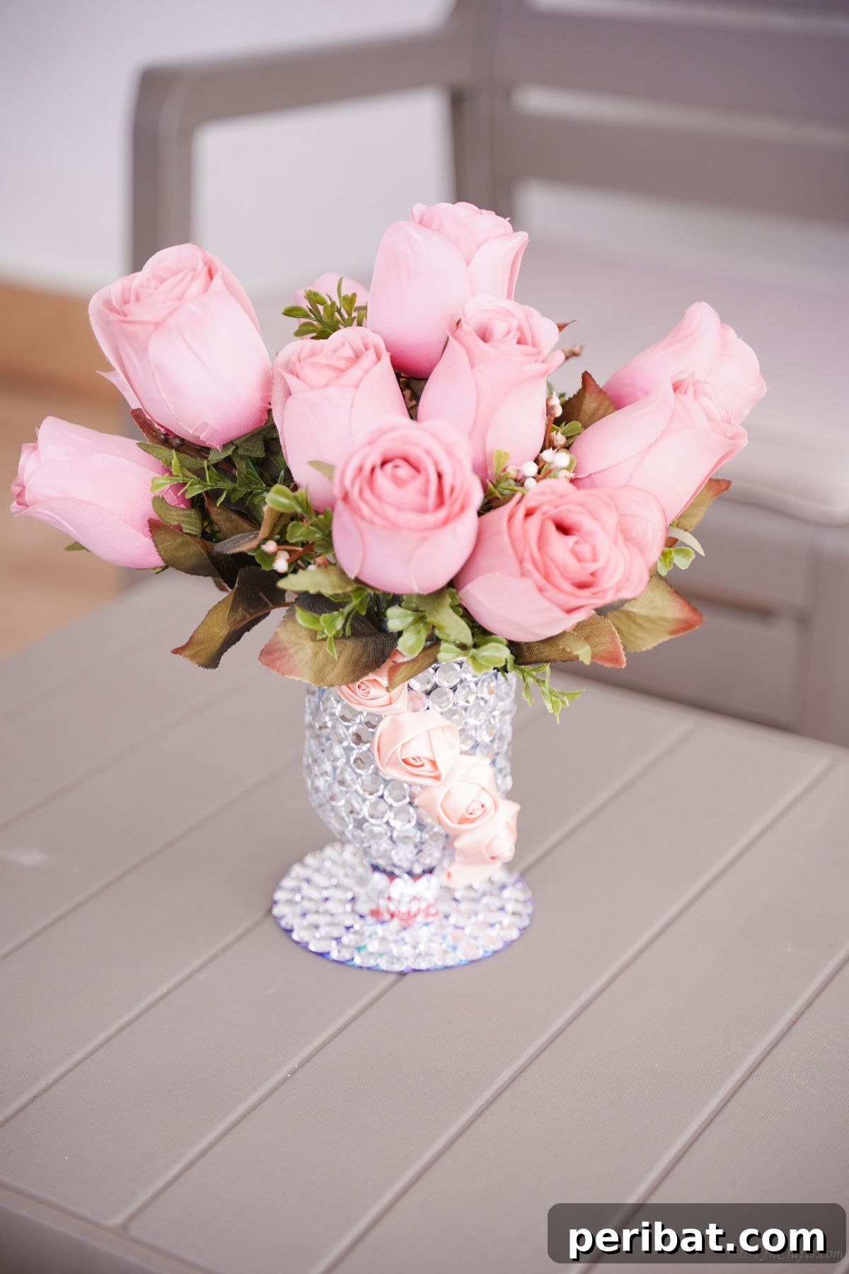 Radiant Recycled Rhinestone Vase 2 pink roses in rhinestone vase on gray table