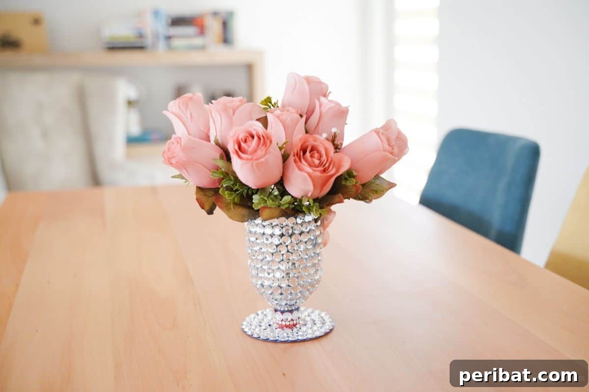 Radiant Recycled Rhinestone Vase 3 plastic bottle vase on dining table with blue chairs