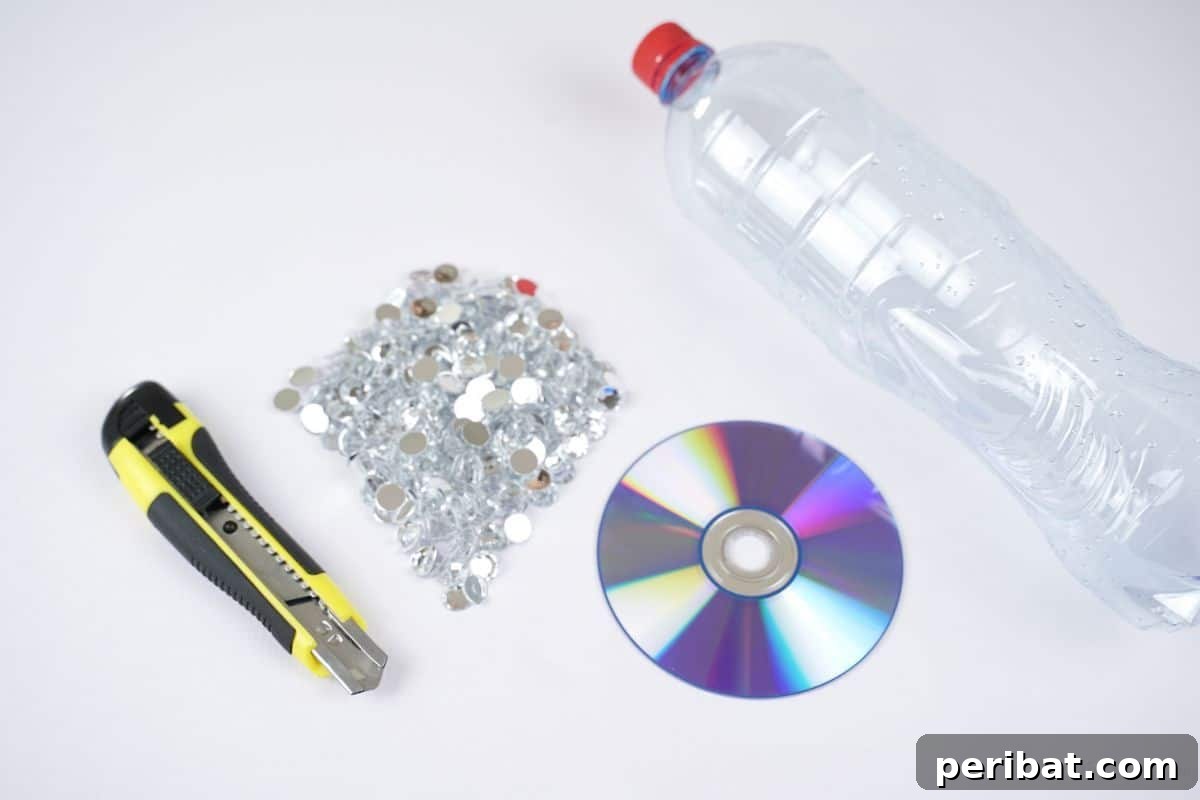 Radiant Recycled Rhinestone Vase 8 rhinestones CD and plastic bottle on white table with craft knife