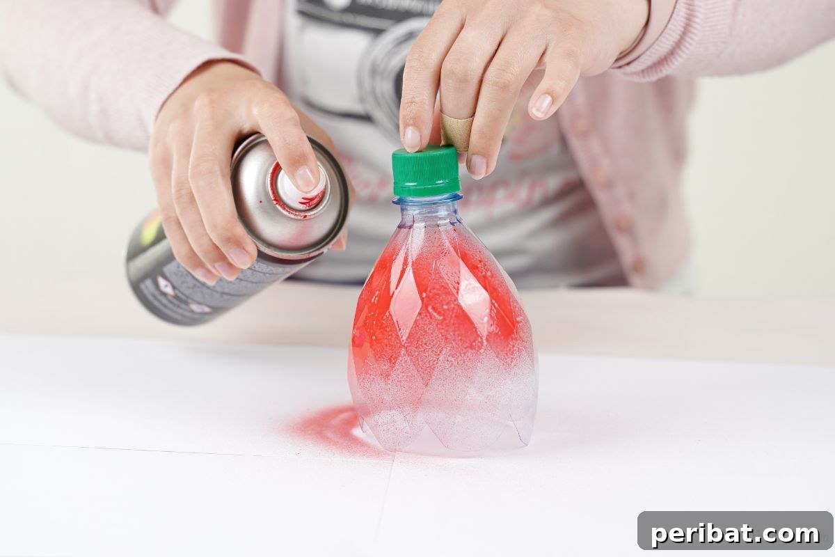 Upcycled Bottle Birdhouse 23 lady spray painting bottle red