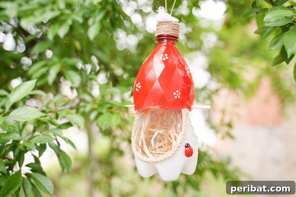 Upcycled Bottle Birdhouse 29 red and white nest in tree for birds