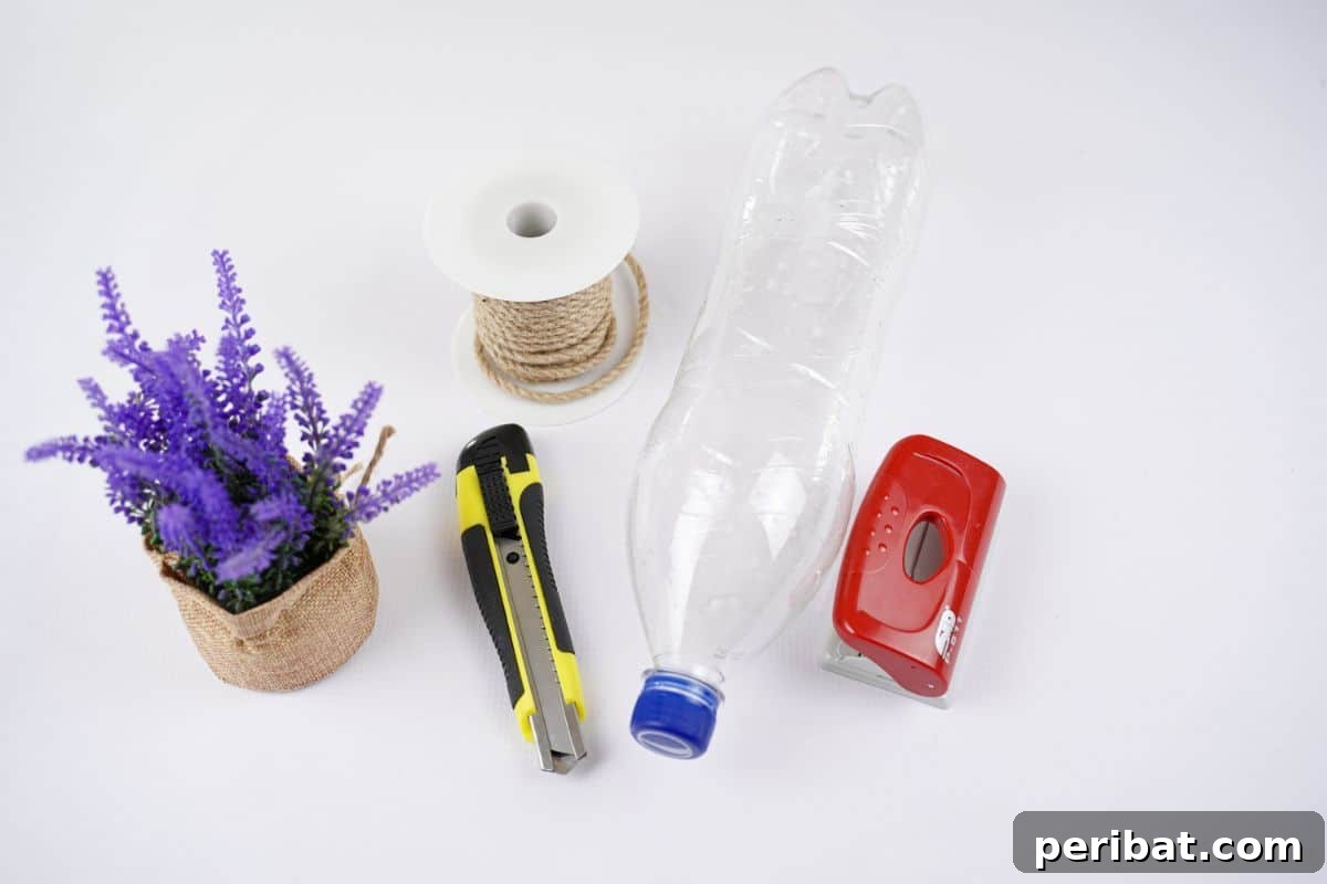 DIY Rustik İp Sarılı Şişe Bahçe Planterları 7 Potted plant, water bottle, and a hole punch laid out on a clean white table, ready for a DIY crafting session.