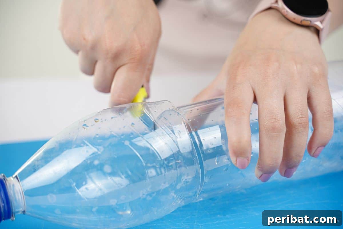 DIY Rustik İp Sarılı Şişe Bahçe Planterları 8 A craft knife precisely cutting an empty water bottle on a blue mat, initiating the DIY planter project.
