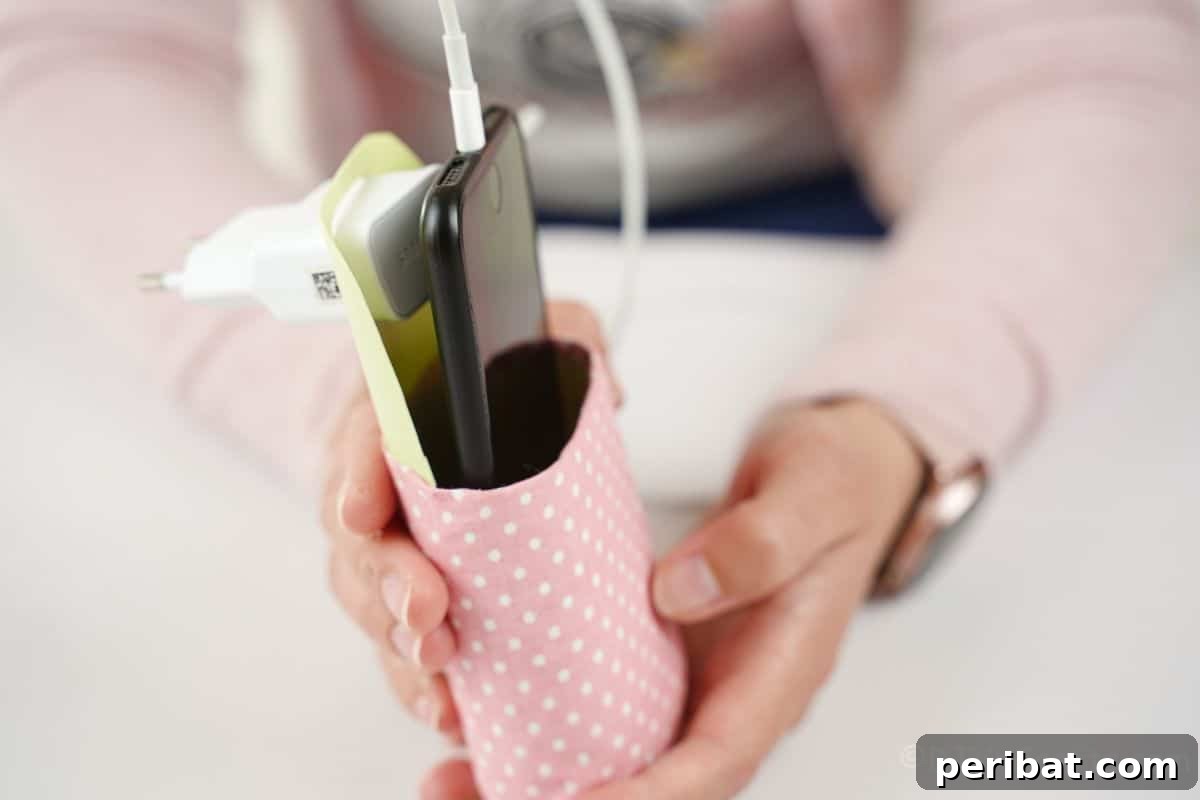 woman holding cellphone holder with phone in it