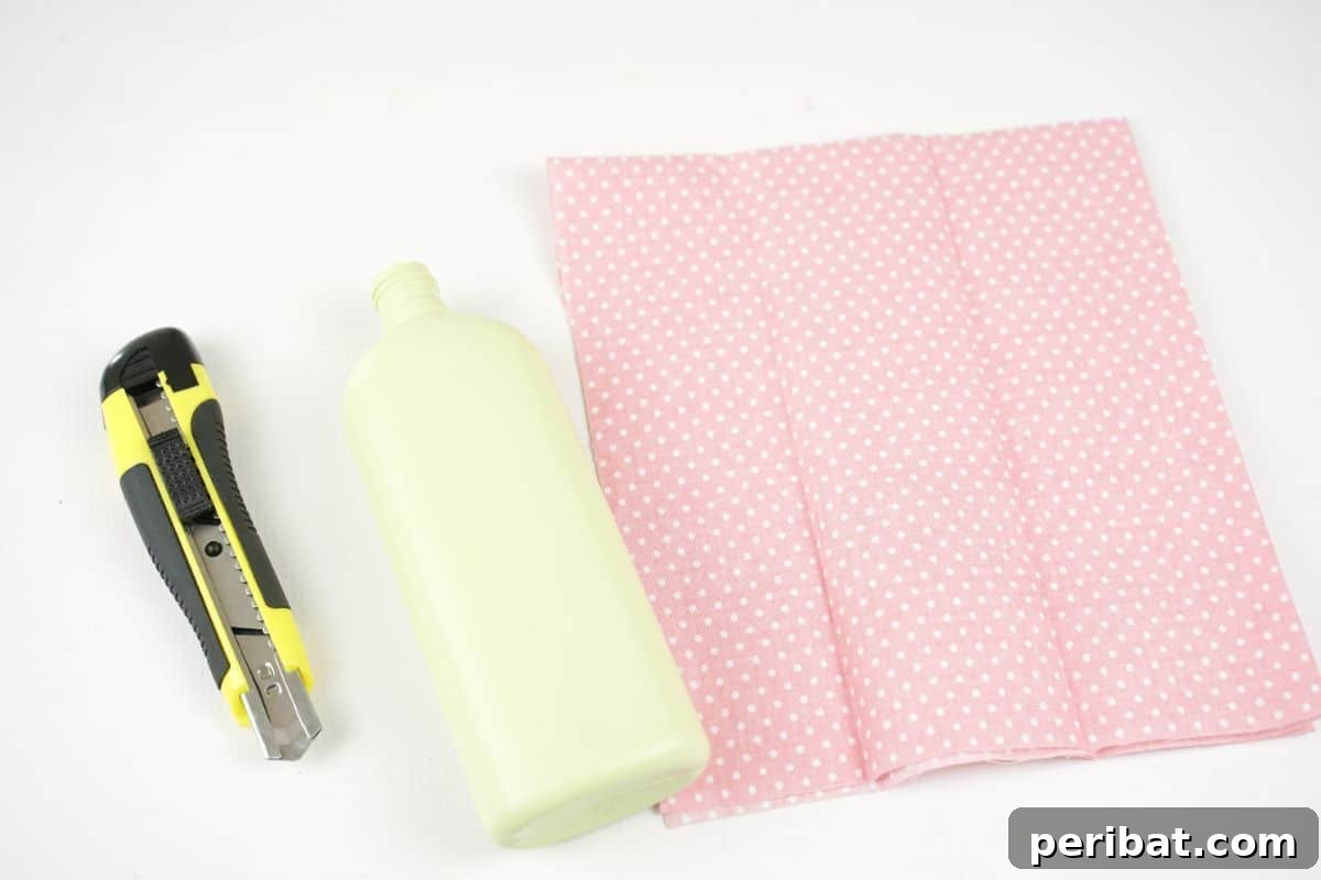 empty bottle pink fabric and craft knife