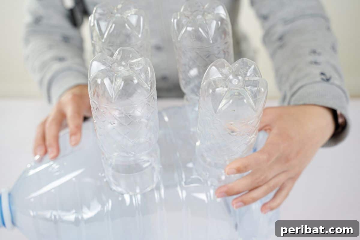 Upcycled Bottles Blossom into Adorable Elephant Planters 11 four plastic bottles glued onto gallon bottle