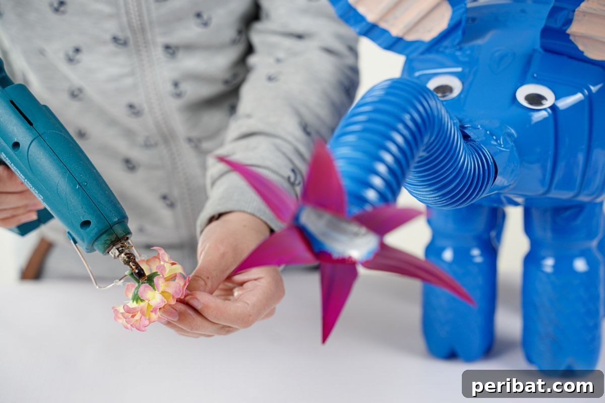 Upcycled Bottles Blossom into Adorable Elephant Planters 20 hot glue added to fake flower