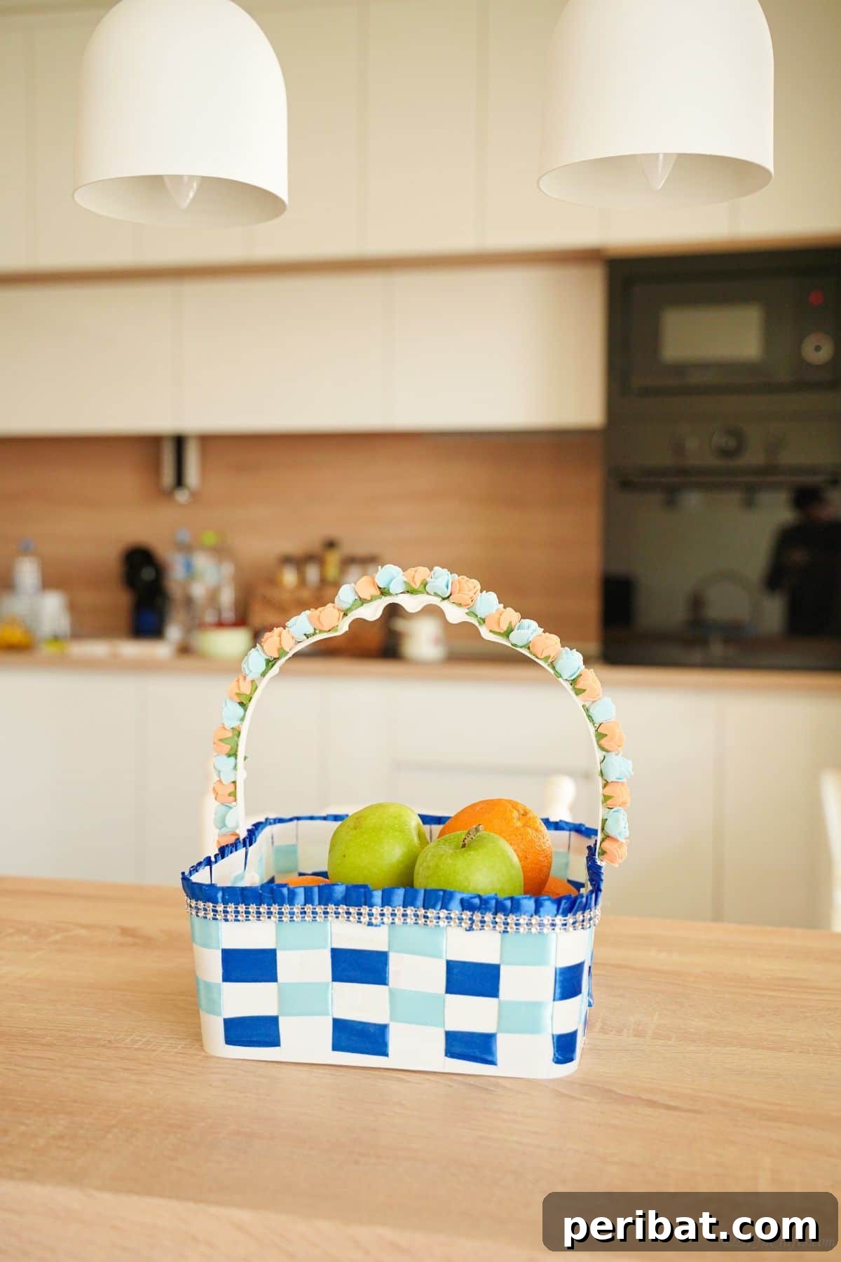 Sweet Treat Pail Transformed Basket 2 Basket of fruit on a table in front of a stove, showcasing a finished upcycled ice cream pail basket.
