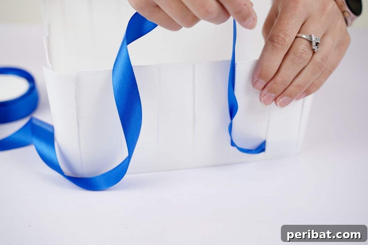 Sweet Treat Pail Transformed Basket 11 Hand gluing royal blue ribbon to the inside bottom corner of a plastic pail.