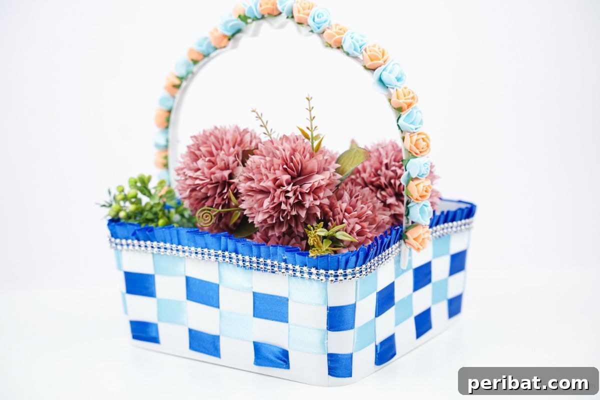Sweet Treat Pail Transformed Basket 16 Plastic basket with blue and white ribbon on a white surface, showcasing the finished craft.