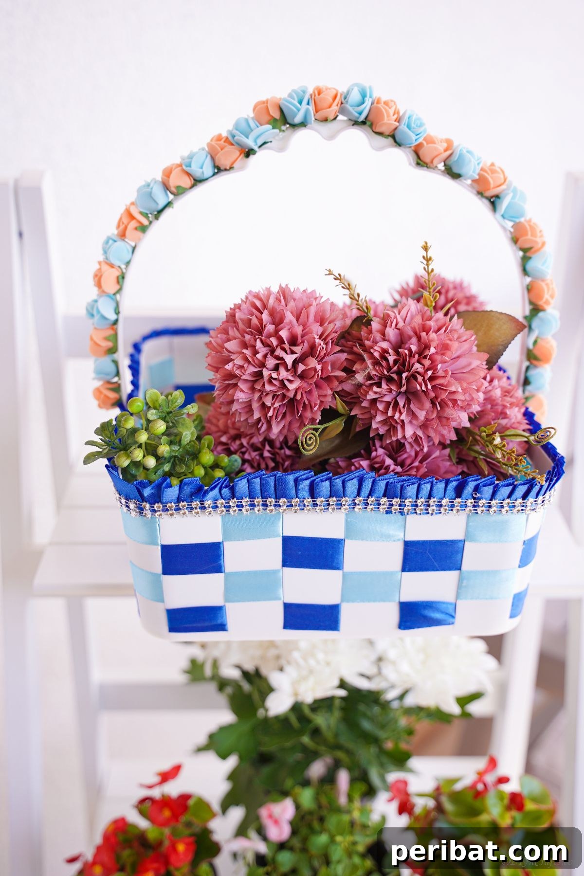Sweet Treat Pail Transformed Basket 4 Blue and white basket of pink flowers on a white shelf, illustrating a beautifully decorated handle.