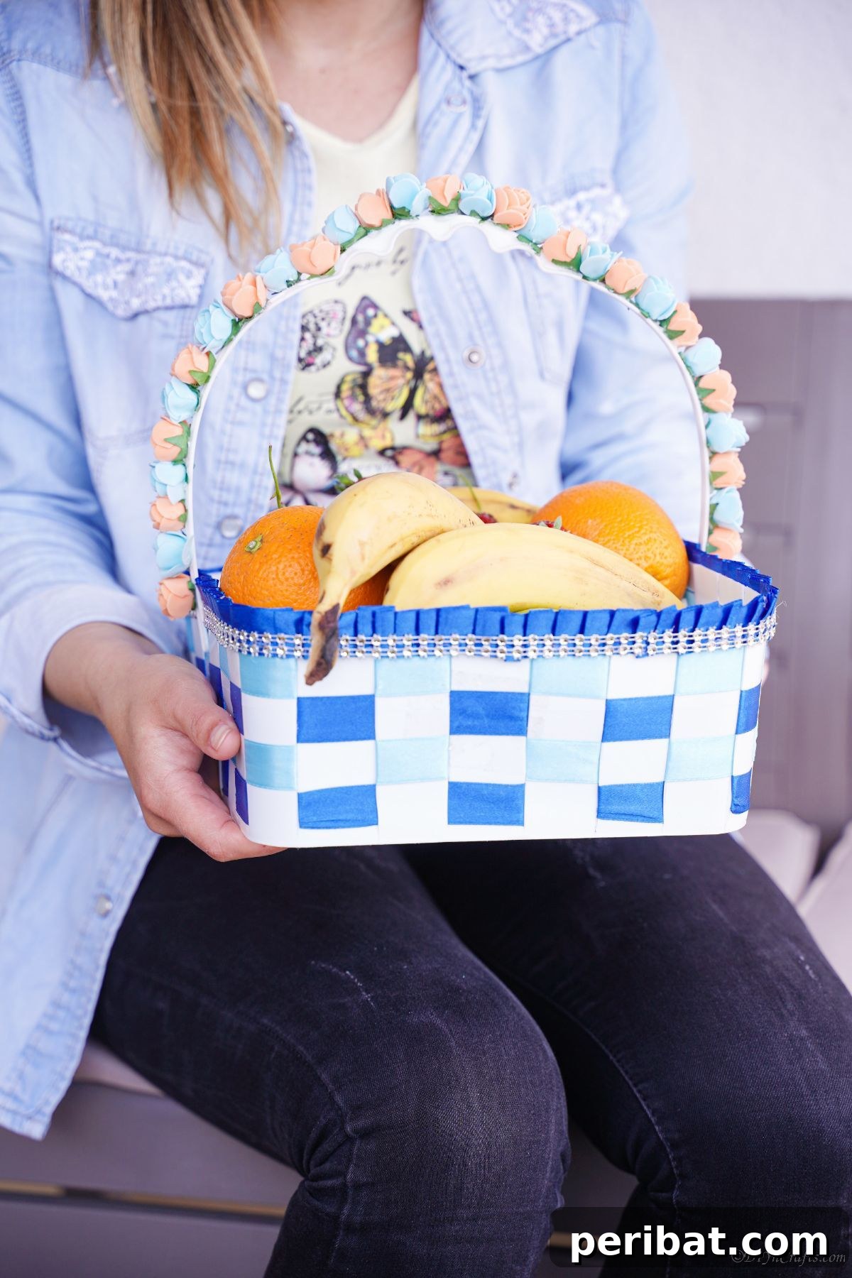 Sweet Treat Pail Transformed Basket 6 Woman holding a basket filled with fruit, demonstrating practical use.