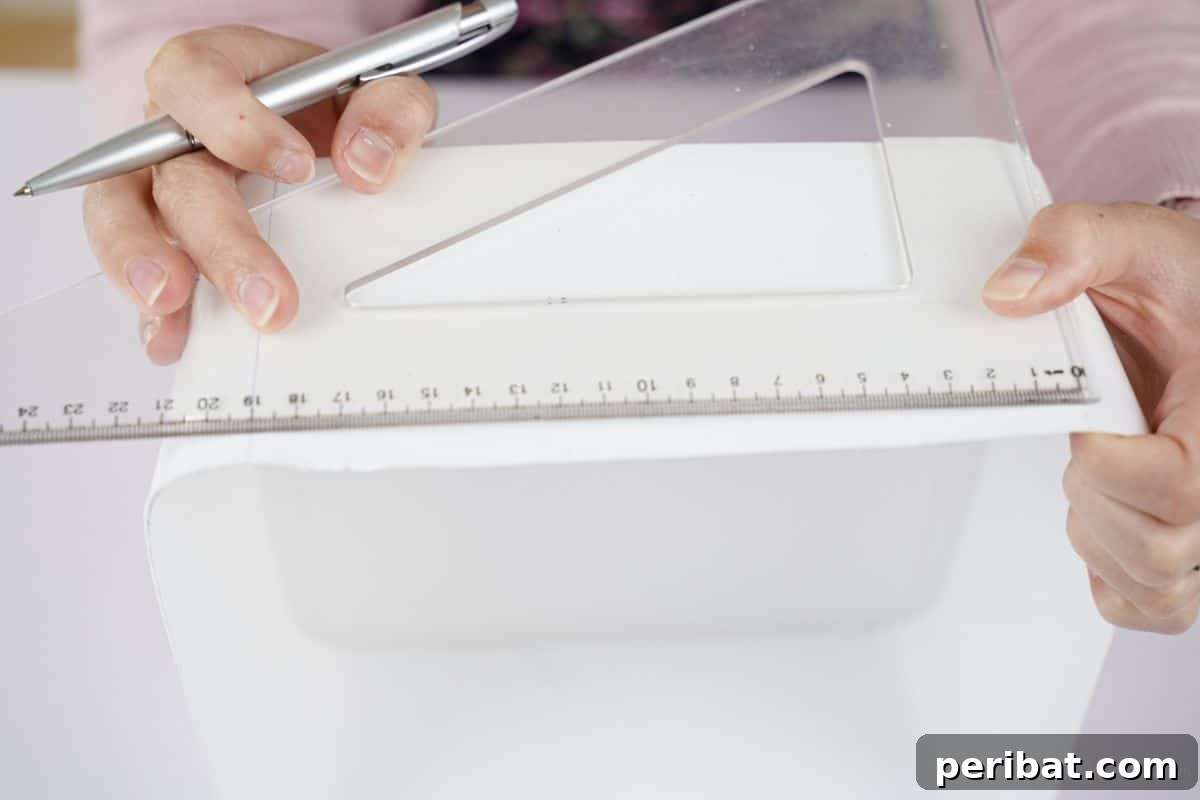 Sweet Treat Pail Transformed Basket 9 Hand measuring the side of a bucket with a ruler and marking points for cuts.