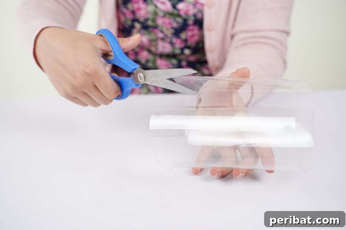 Eco-Chic Bottle Bags: Colorful DIY 14 blue scissors cutting into plastic bottle