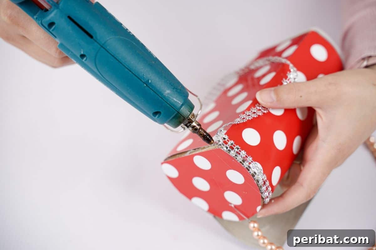 Eco-Chic Bottle Bags: Colorful DIY 18 blue glue gun holding beaded ribbon on side of purse