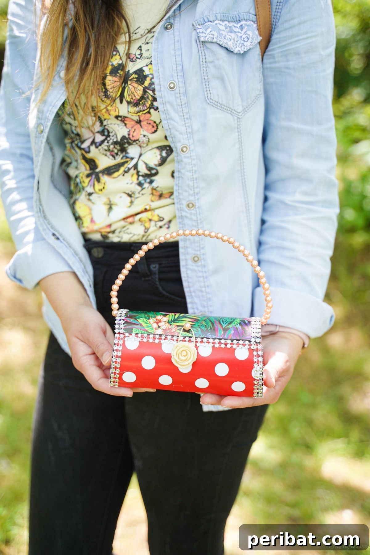Eco-Chic Bottle Bags: Colorful DIY 23 woman in blue jacket holding polka dot purse