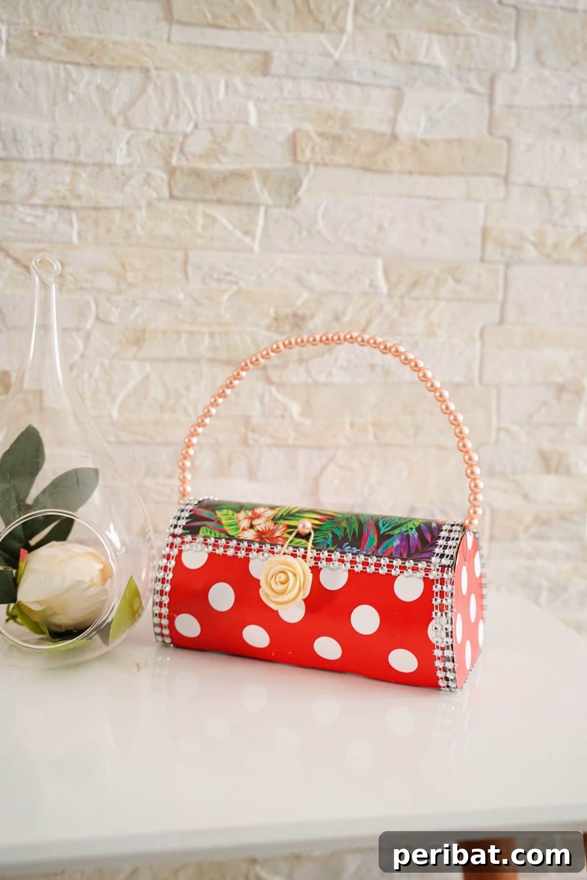 Eco-Chic Bottle Bags: Colorful DIY 24 red and white purse on table with cream brick background