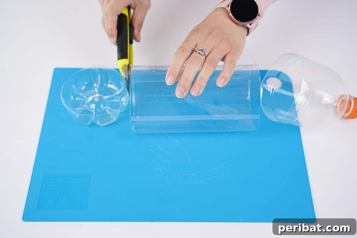 Eco-Chic Bottle Bags: Colorful DIY 9 craft knife cutting soda bottle on blue mat