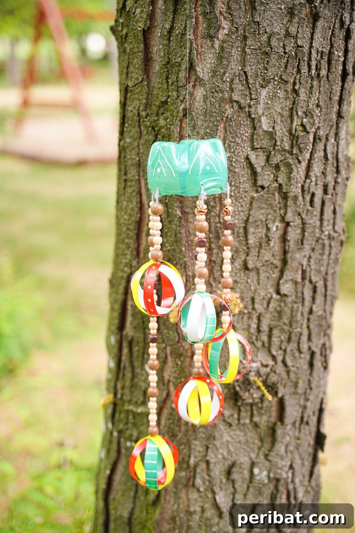Beaded Bottle Breeze Song 2 beaded windchime in tree