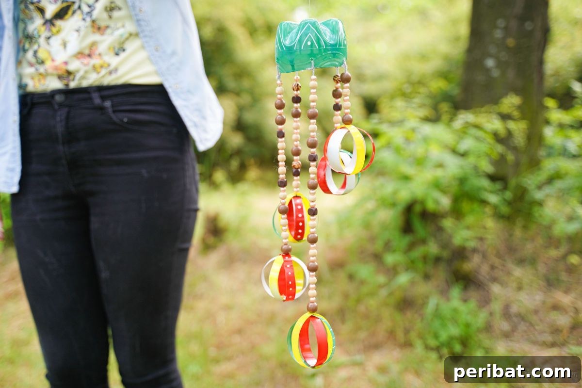 Beaded Bottle Breeze Song 5 woman holding wind chime outside