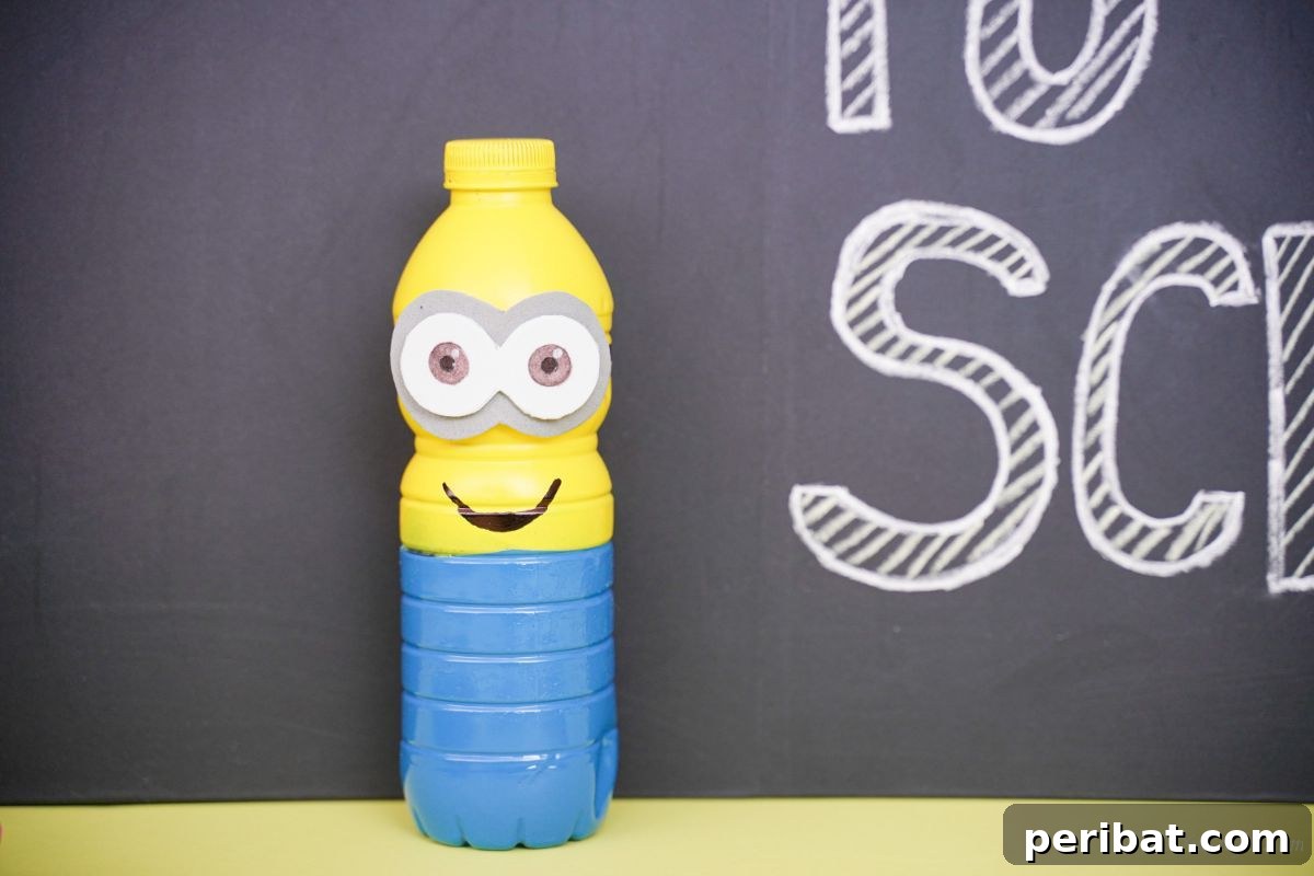 Upcycled Bottle Minion Creations 3 A close-up shot of a meticulously painted yellow and blue plastic bottle Minion, standing against a sleek black background, highlighting its vibrant colors.