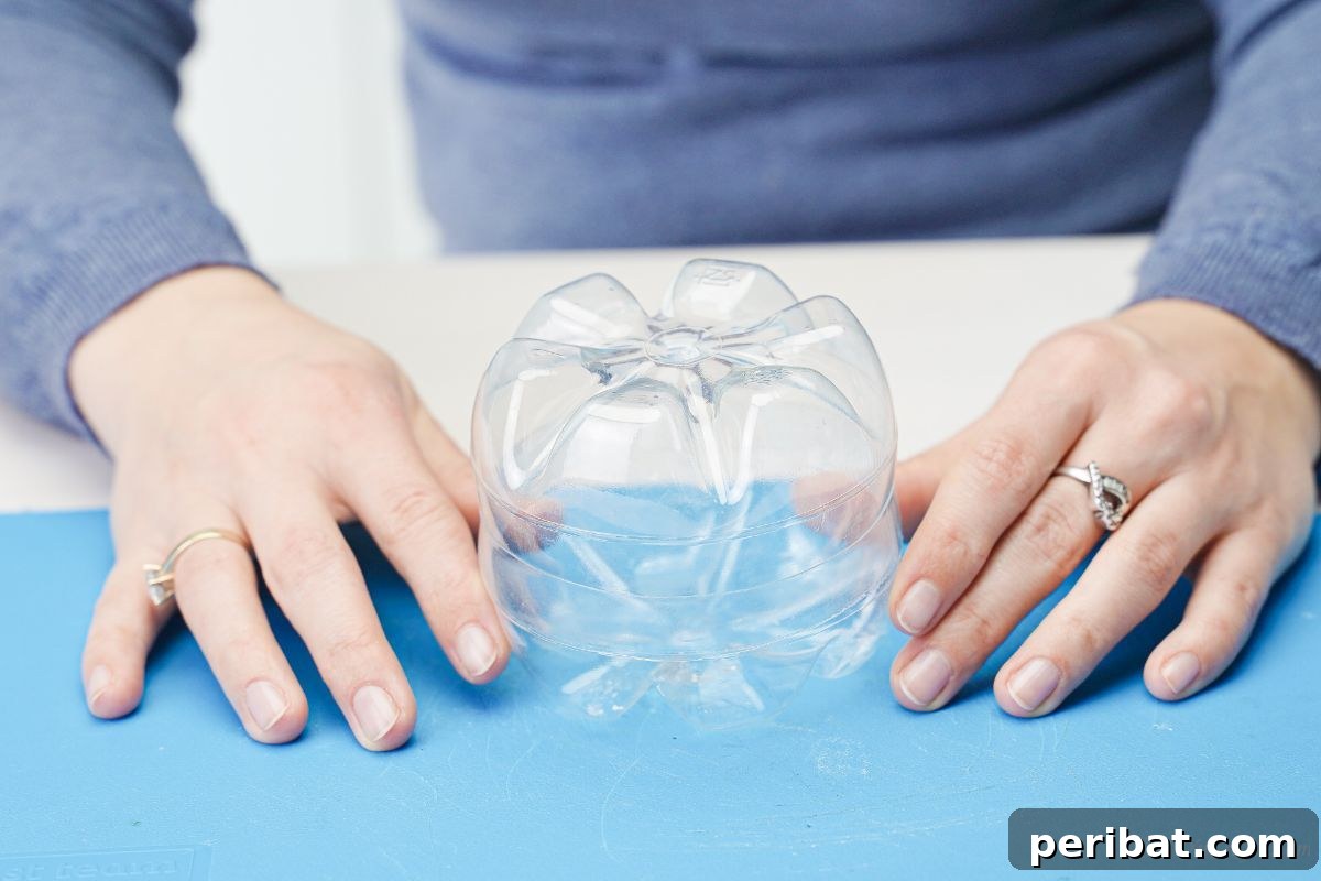 Charming Apple Plastic Bottle Teacher Gift 14 hands holding bottle pieces together on blue mat