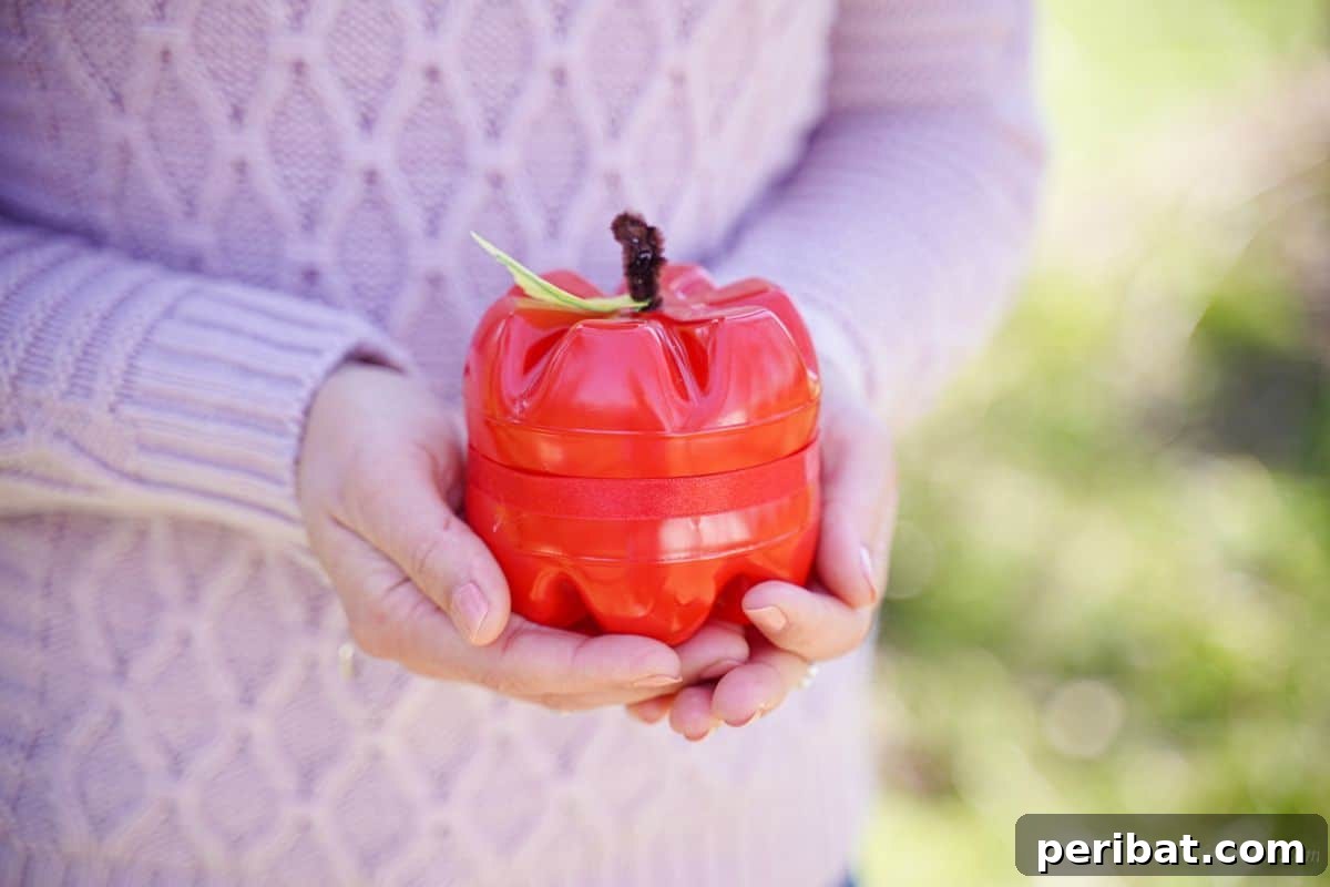 Charming Apple Plastic Bottle Teacher Gift 6 woman in pink sweater holding plastic apple