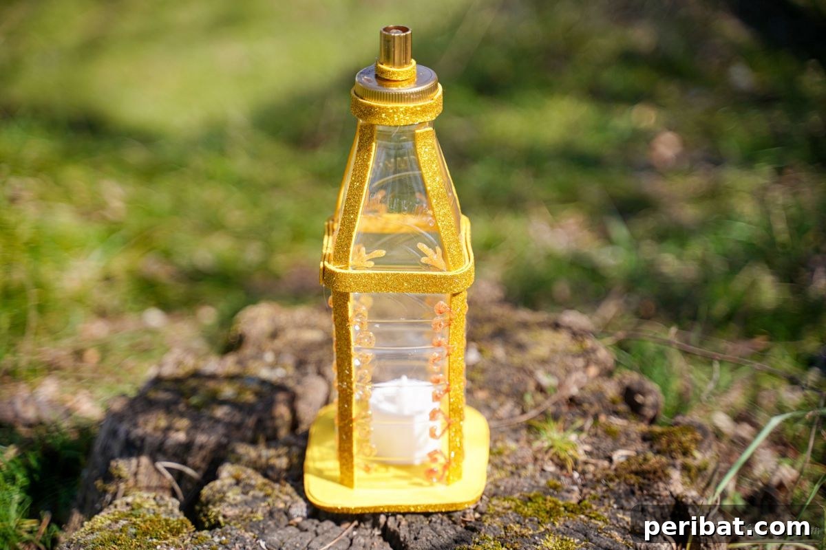 Upcycled Bottle Glow 15 The finished plastic bottle lantern with an LED candle inside, placed outdoors on a wooden surface.