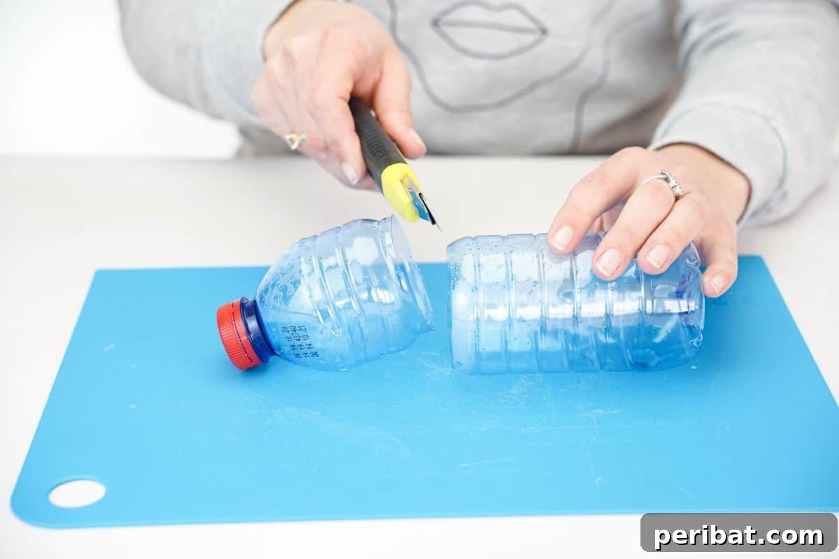 Upcycled Plastic Bottle Blossoms 9 Craft knife cutting a plastic bottle on a blue cutting mat