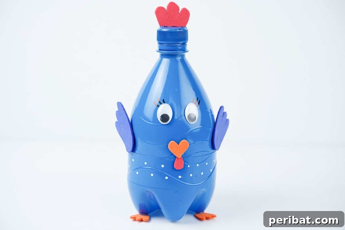 Blue plastic bottle turkey craft against a clean white background, showcasing details.